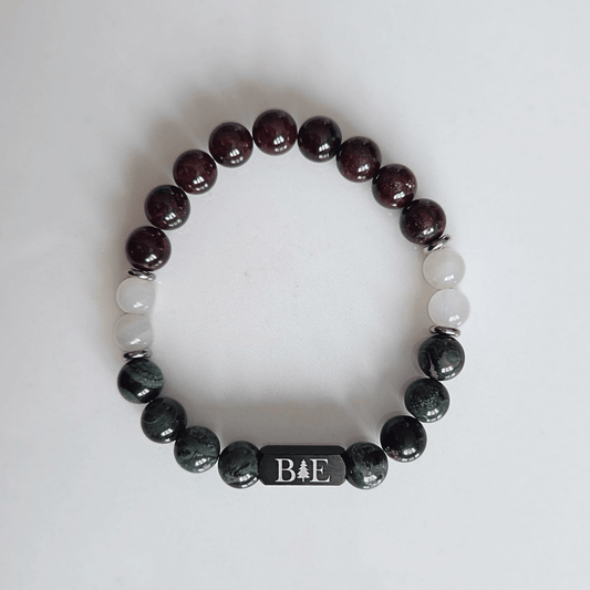 Men’s fertility support crystal bracelet with garnet, moonstone, and green aventurine, designed for strength, balance, and emotional resilience.