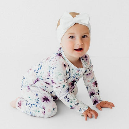 baby wearing bamboo romper purple floral print soft breathable baby outfit with headband