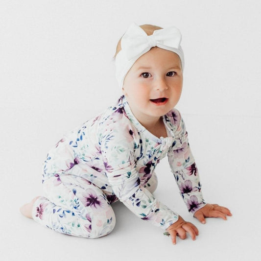baby wearing bamboo romper purple floral print soft breathable baby outfit with headband