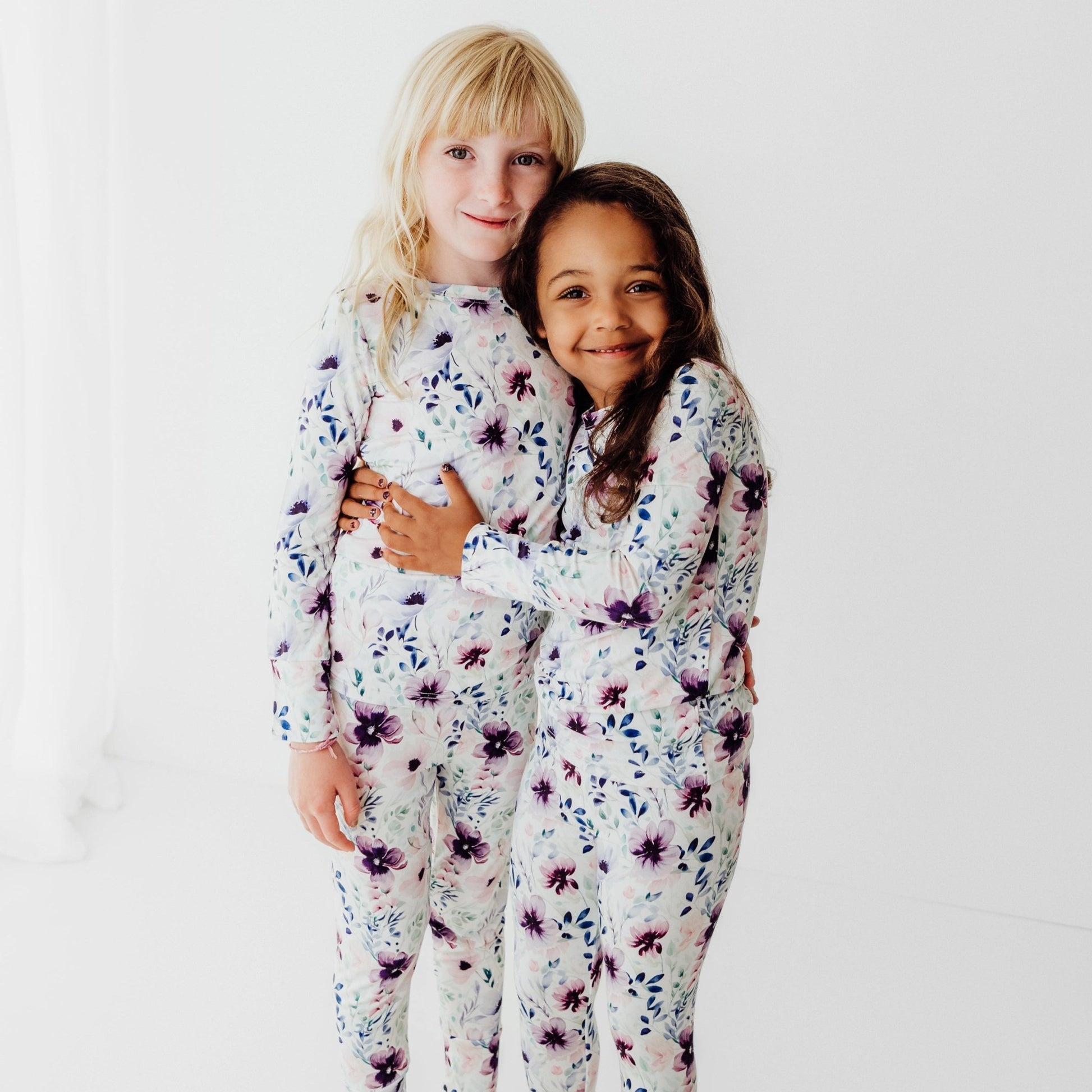 toddler wearing bamboo two piece pajamas purple floral print soft breathable kids sleepwear